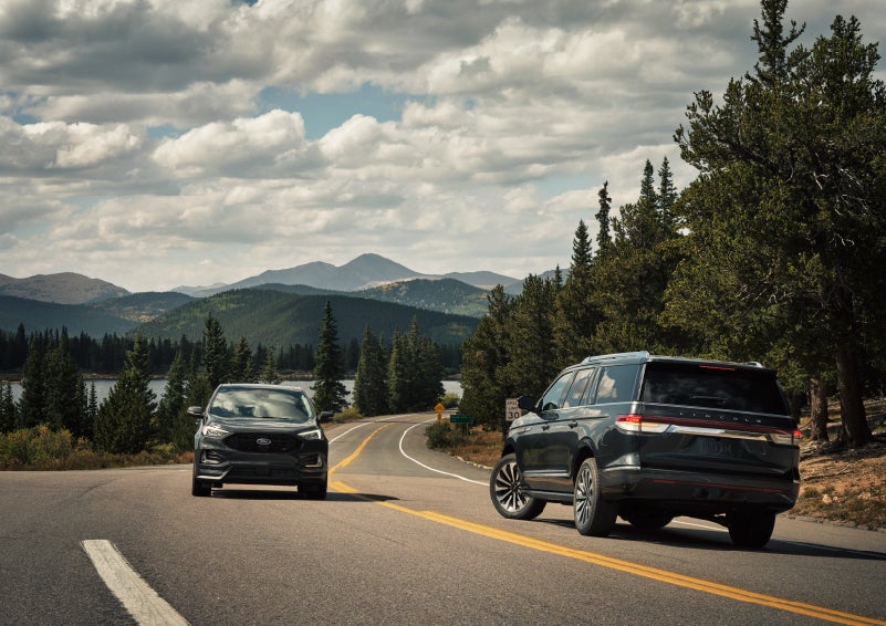 A 2022 Lincoln Navigator SUV is making a left turn as another vehicle approaches from the other lane | Irwin Lincoln in Freehold NJ
