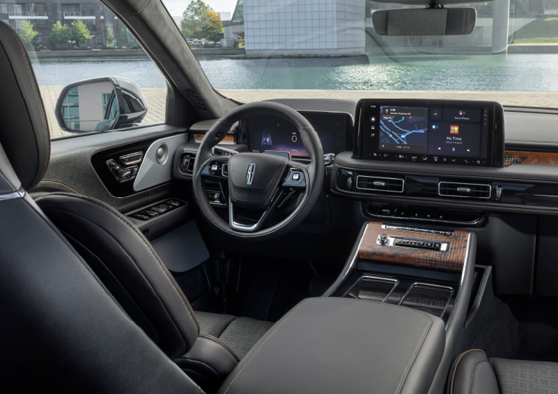 The interior of the 2025 Lincoln Aviator® SUV is shown parked with a view of a harbor through the windshield. | Irwin Lincoln in Freehold NJ