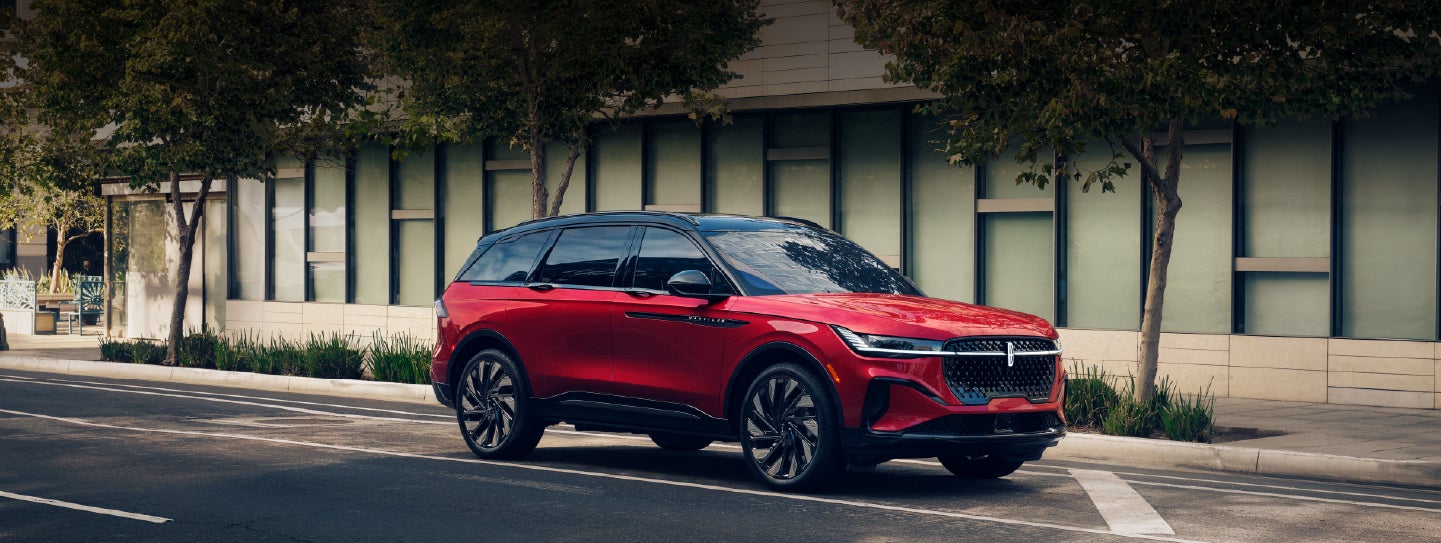A 2025 Lincoln Nautilus® SUV with an available hybrid powertrain is parked in an urban setting. | Irwin Lincoln in Freehold NJ