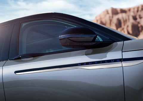 Blue lettering on the side of the vehicle that reads nautilus indicates the available hybrid powertrain. | Irwin Lincoln in Freehold NJ