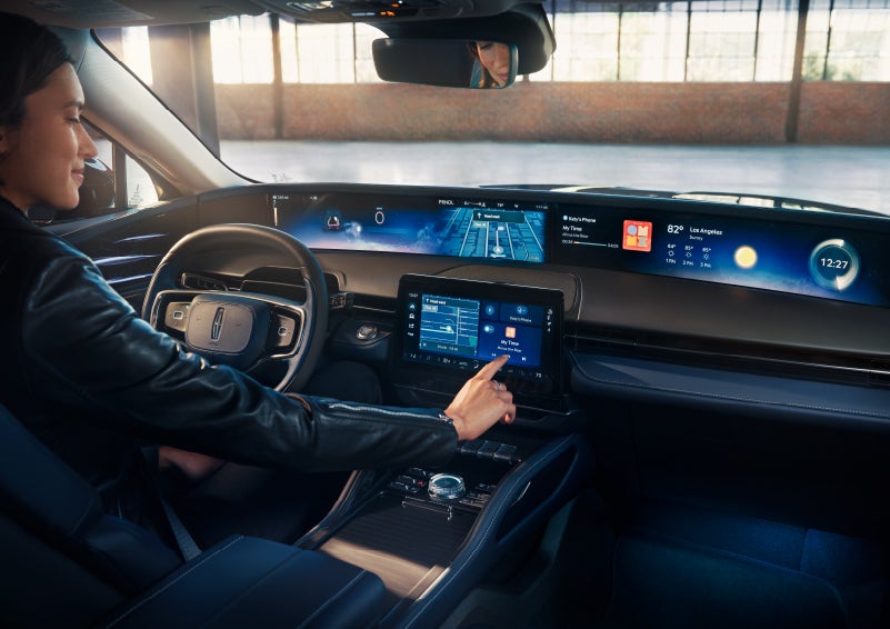The driver of a 2025 Lincoln Nautilus® SUV interacts with the center touchscreen. | Irwin Lincoln in Freehold NJ