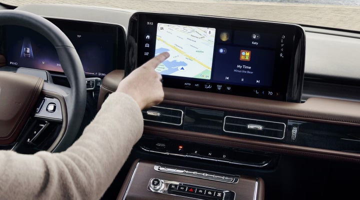 A person is tapping the center display touchscreen of a 2026 Lincoln Aviator® SUV. | Irwin Lincoln in Freehold NJ