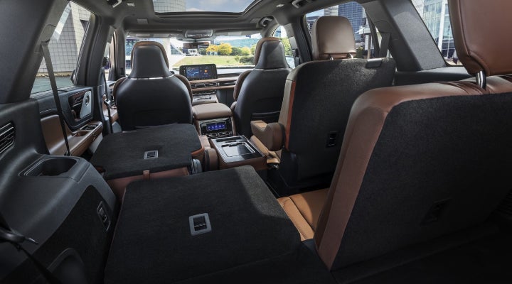 One side of the PowerFold® third-row seat and a second-row seat are folded forward in the 2026 Lincoln Aviator® SUV. | Irwin Lincoln in Freehold NJ