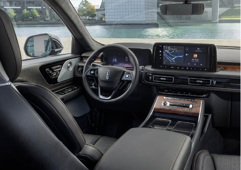 The interior of the 2026 Lincoln Aviator® SUV is shown parked with a view of a harbor through the windshield. | Irwin Lincoln in Freehold NJ