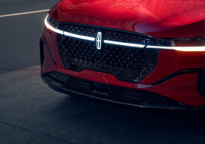 The available front LED light bar and center Lincoln Star logo glow at dusk. | Irwin Lincoln in Freehold NJ