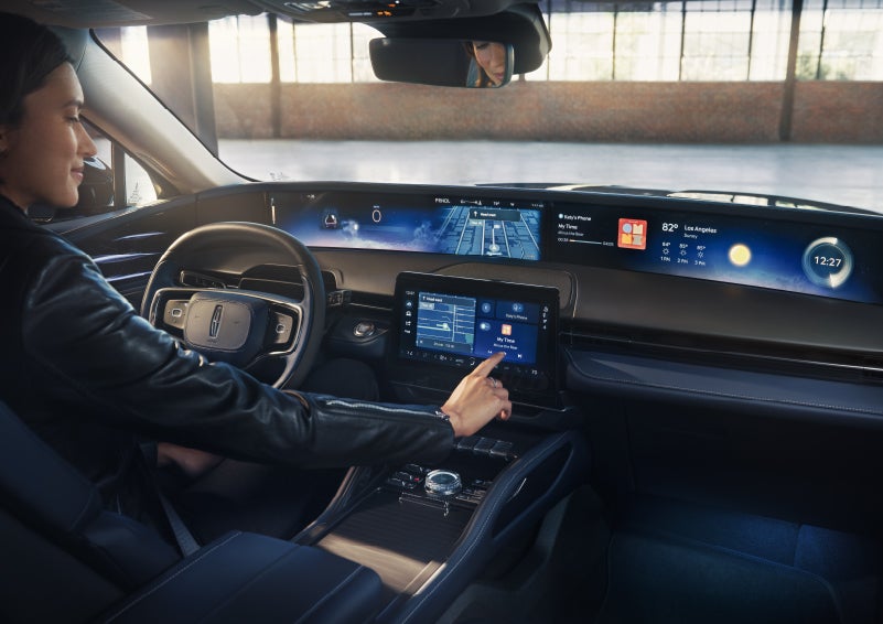 The driver of a 2026 Lincoln Nautilus® SUV interacts with the center touchscreen. | Irwin Lincoln in Freehold NJ