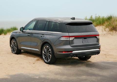 A 2027 Lincoln Aviator® SUV is parked next to sand dunes. | Irwin Lincoln in Freehold NJ