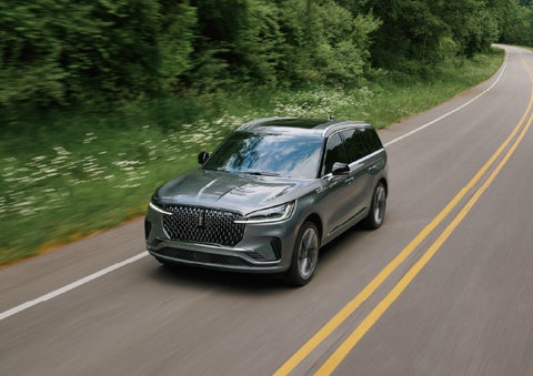 A 2027 Lincoln Aviator® SUV is being driven down a road. | Irwin Lincoln in Freehold NJ