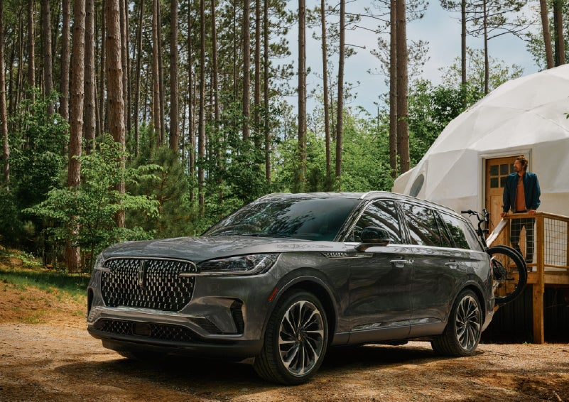 A 2027 Lincoln Aviator® is parked next to a high end glamping site. | Irwin Lincoln in Freehold NJ