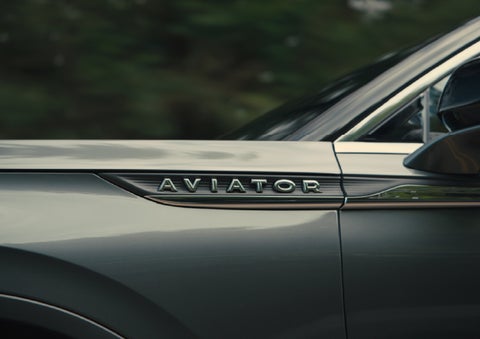 The driver’s side door and fender badging of a gray 2027 Lincoln Aviator® SUV are showcased. | Irwin Lincoln in Freehold NJ