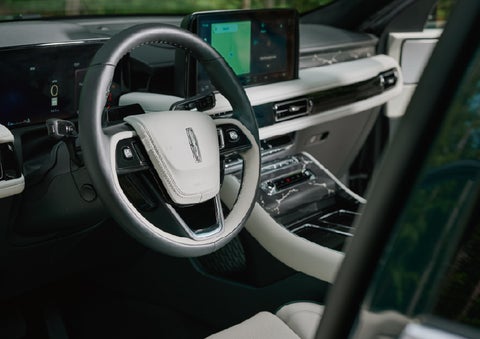 The leather-trimmed steering wheel of a 2027 Lincoln Aviator® Black Label™ SUV. | Irwin Lincoln in Freehold NJ